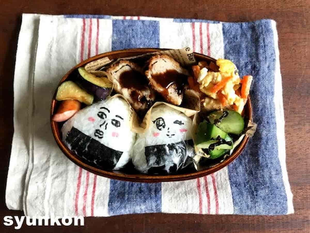 美女と青年のメンチカツ弁当